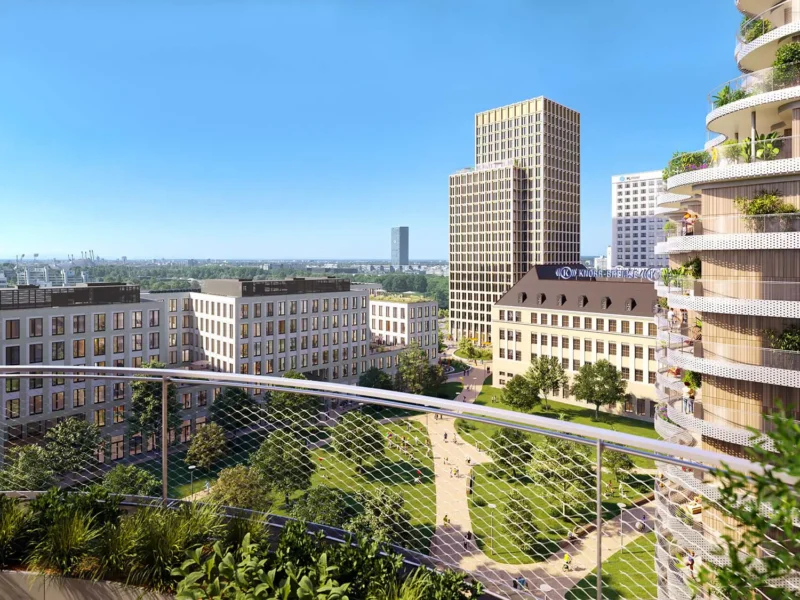 Blick über ein neues Stadtquartier mit zentralem Park, Wohn- und Bürohäusern und dem historischen Knorr-Bremse-Gebäude